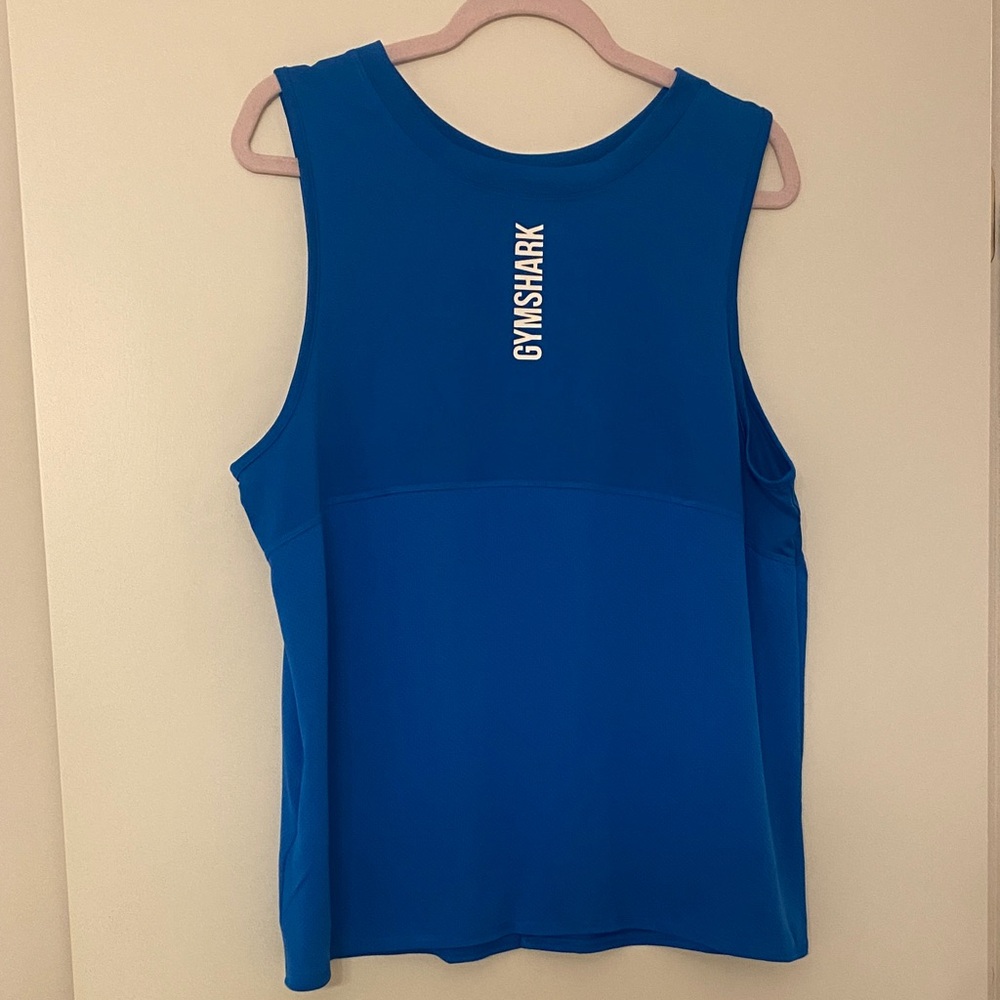 Blue Gymshark tank top with open slit back